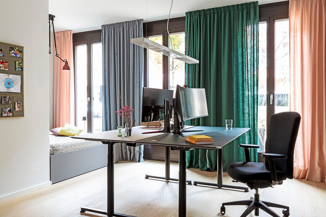 Modern furnished study with different coloured curtains