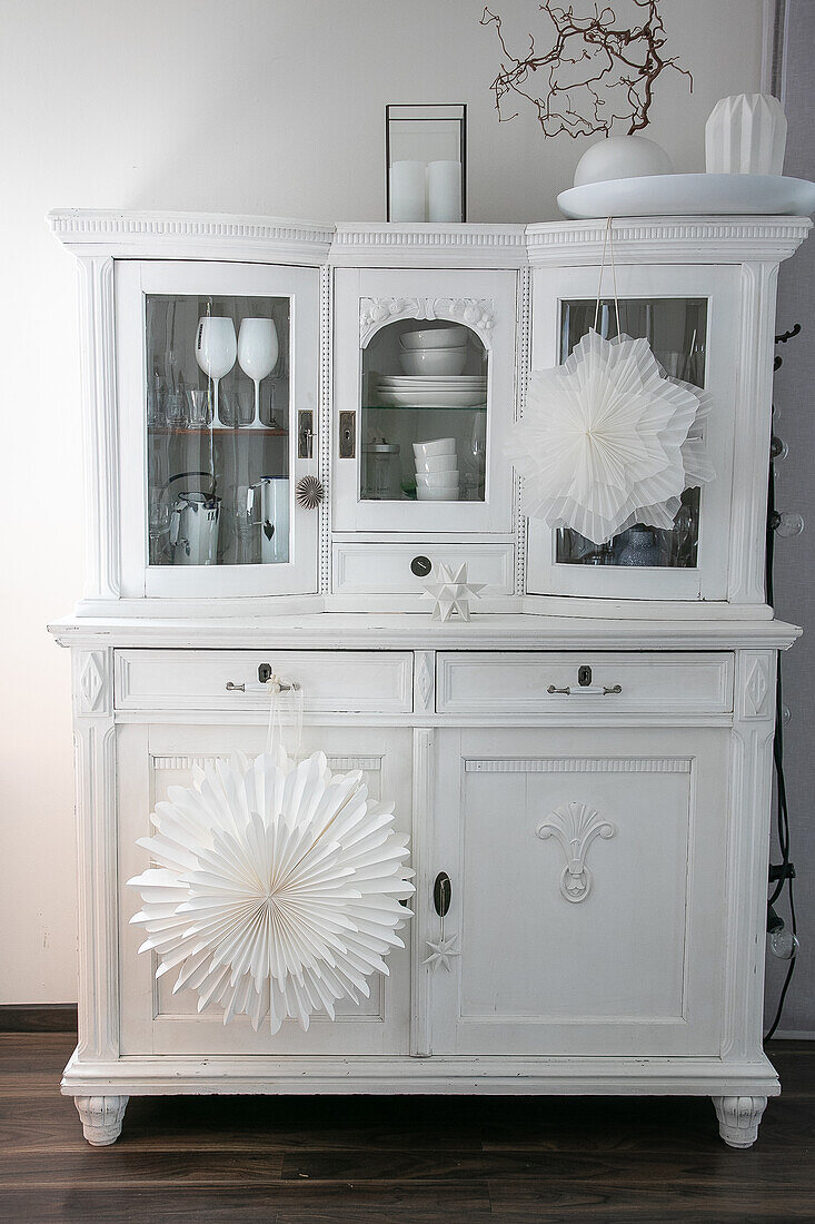 White kitchen buffet with homemade paper stars