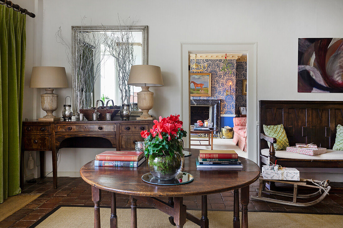 Living room with antique furniture and flower arrangement on the table