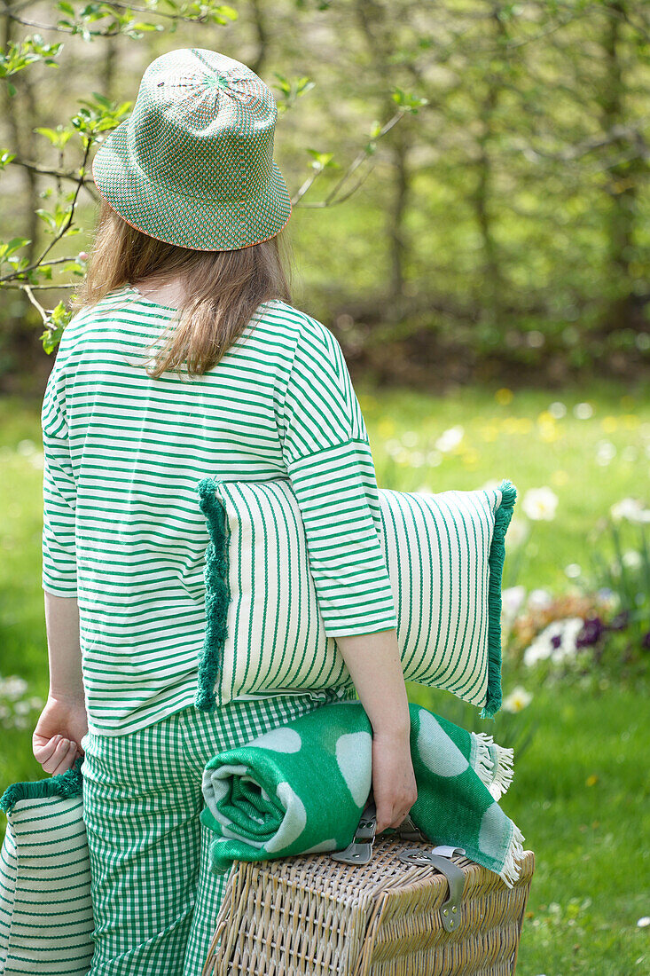 Woman in a green outfit at a picnic