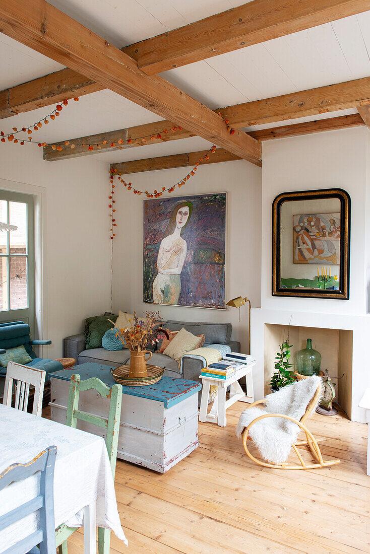 Bright living room with vintage furniture and wooden floorboards