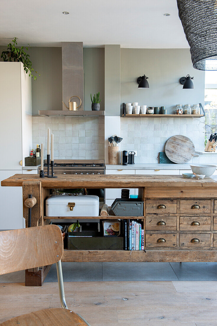 Modern kitchen with open shelves, rustic wood and plants