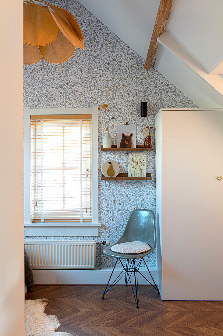 Attic room with floral wallpaper