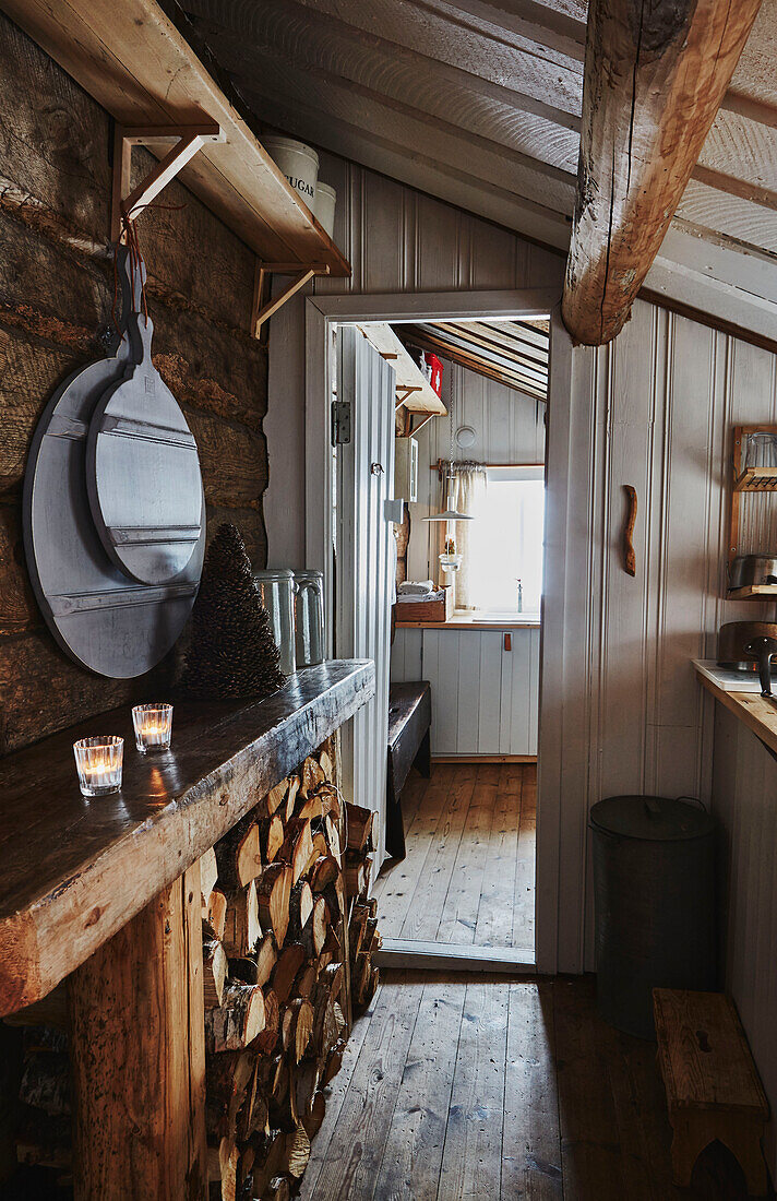 Corridor through kitchen to bathroom inside Wooden cabin situated in the mountains of Sirdal, Norway