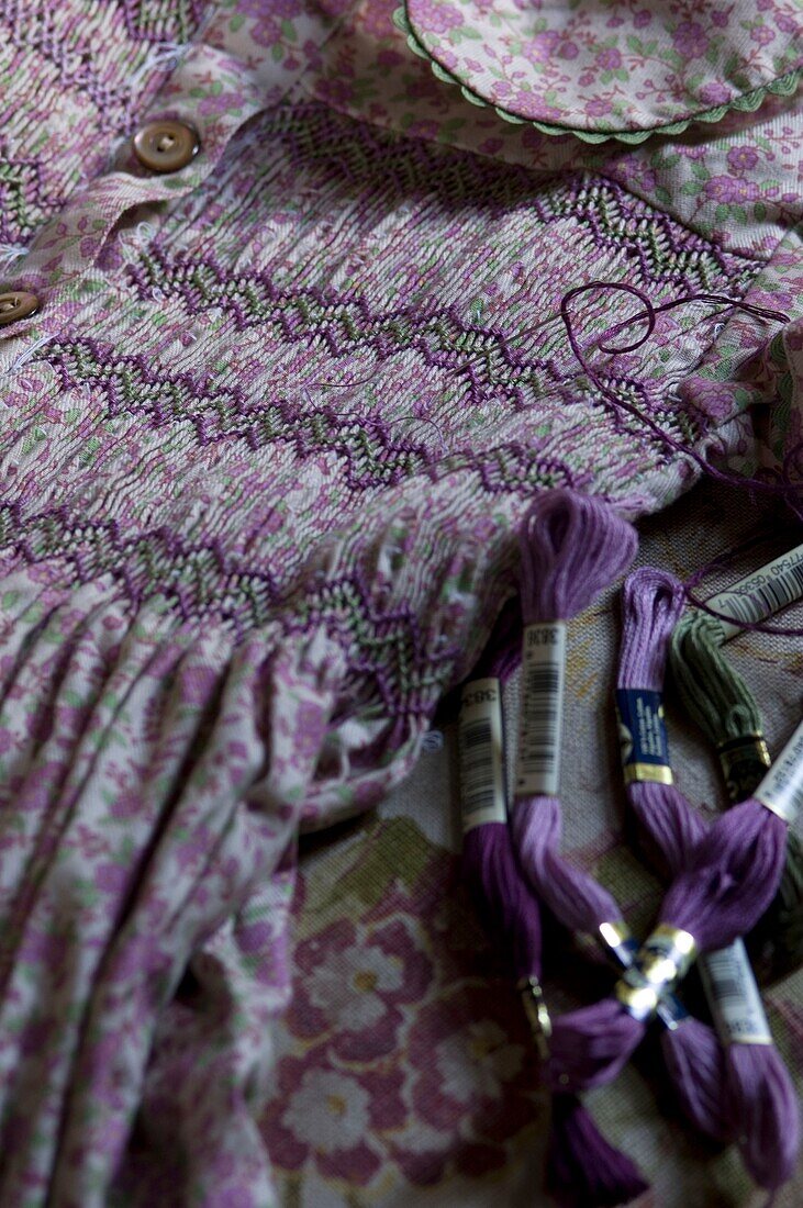 Close-up of purple yarns on purple dress