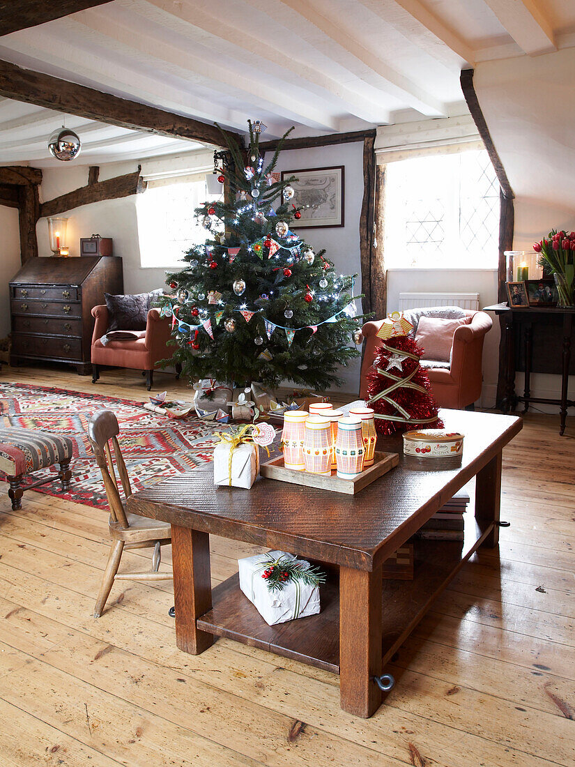 Christmas tree in open plan dining room of Herefordshire cottage, England, UK