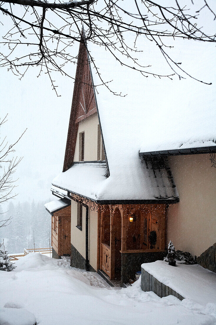Snow covered mountain chalet in Poland