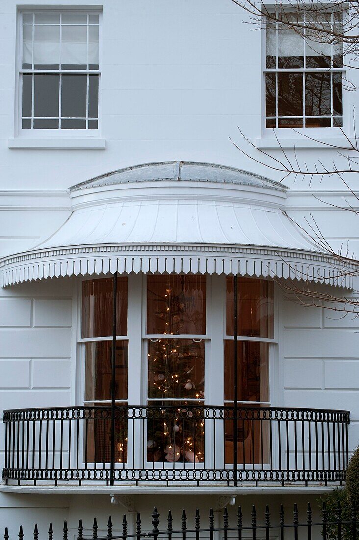 Christmas tree illuminated in house window