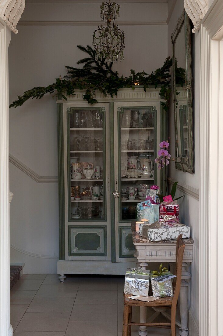 Christmas presents on small table in home