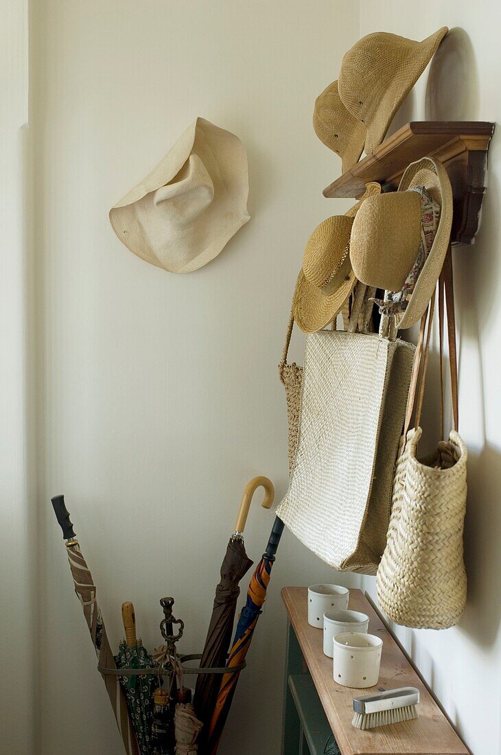 Hats hanging on wall and shelf