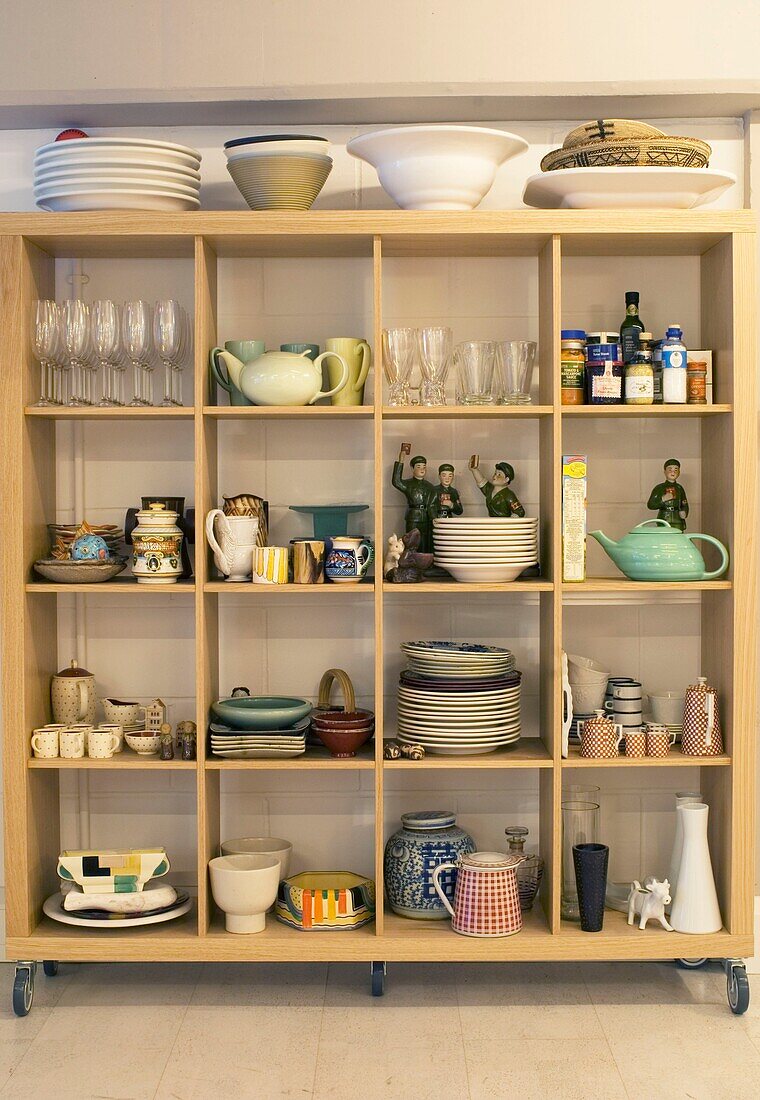 Shelf with crockery in modern kitchen