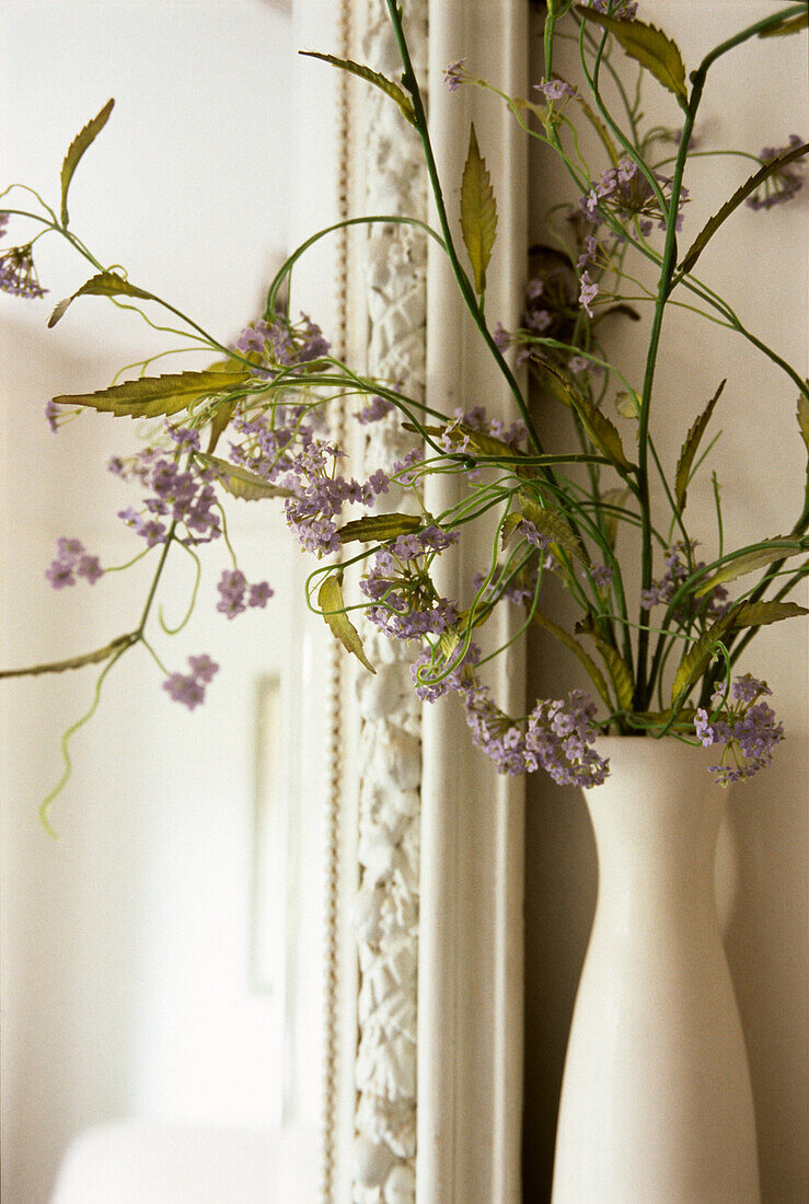 Flower arrangement on a mantelpiece