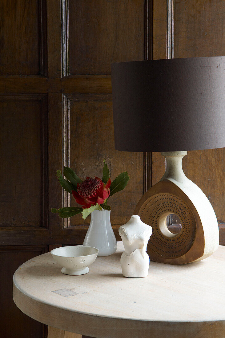 Brown lampshade on table in wood panelled room