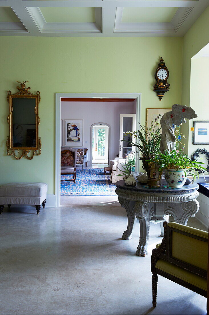 Circular table with view through doorway in Massachusetts home, New England, USA