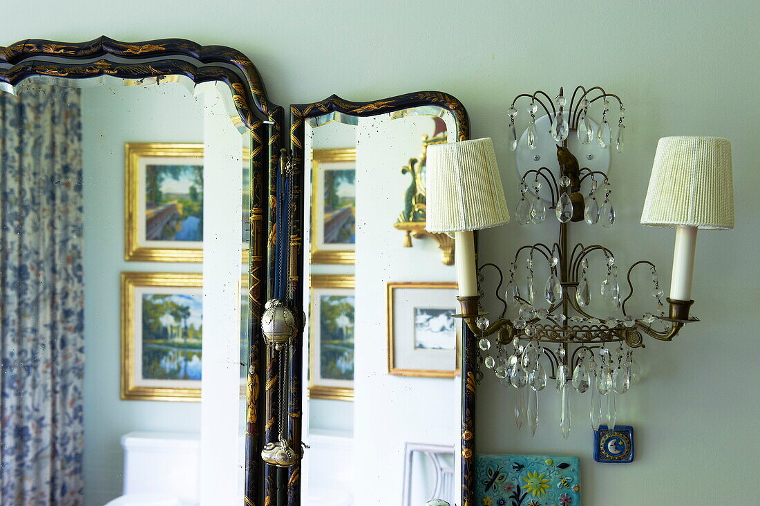 Cut glass wall sconce and vintage mirror in Massachusetts home, New England, USA