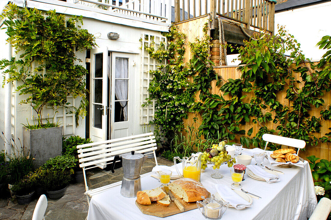 Table laid for breakfast in the garden