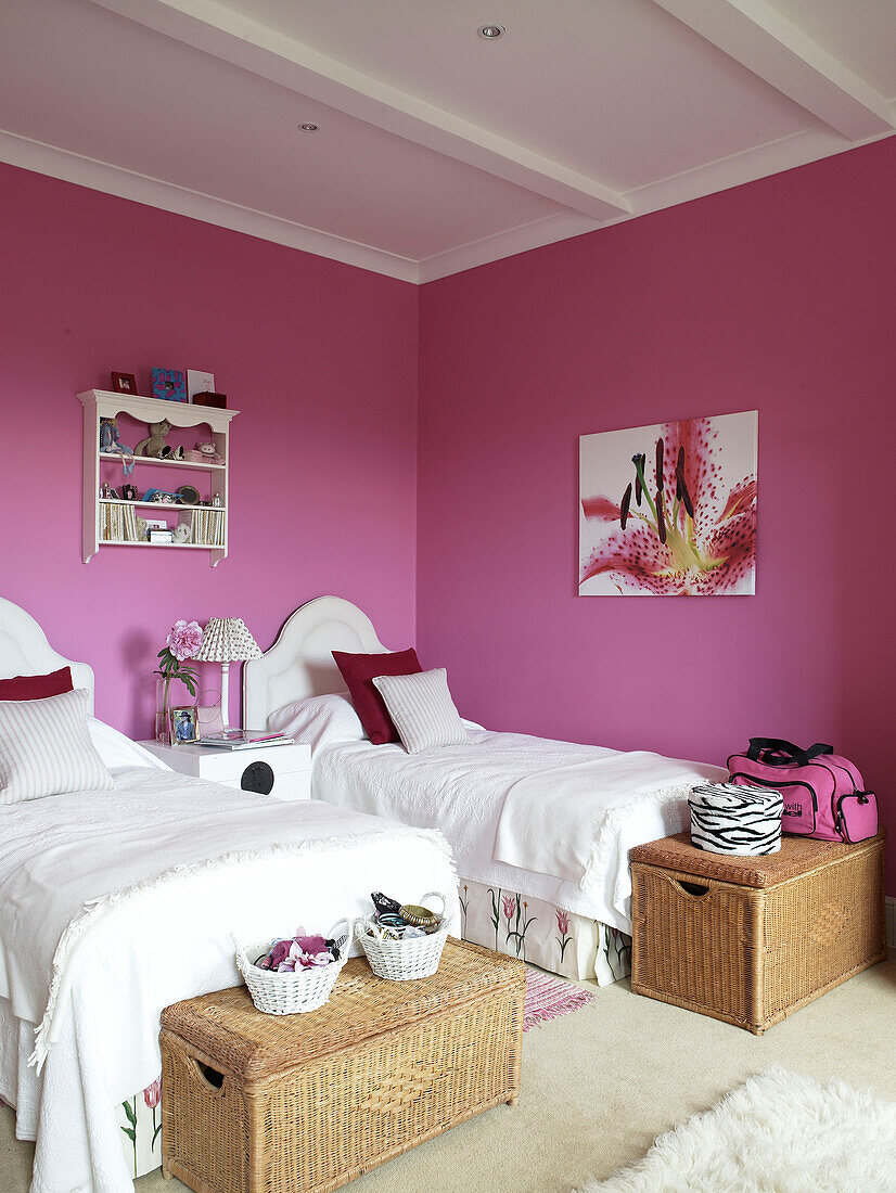 Twin beds in pink bedroom of Lincolnshire country house, England, UK