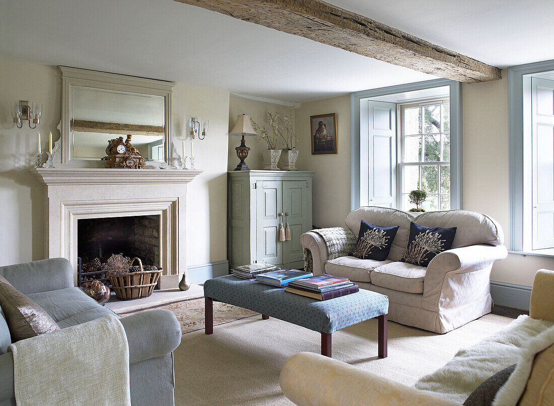 Light blue paintwork in beamed sitting room of Gloucestershire farmhouse, England, UK