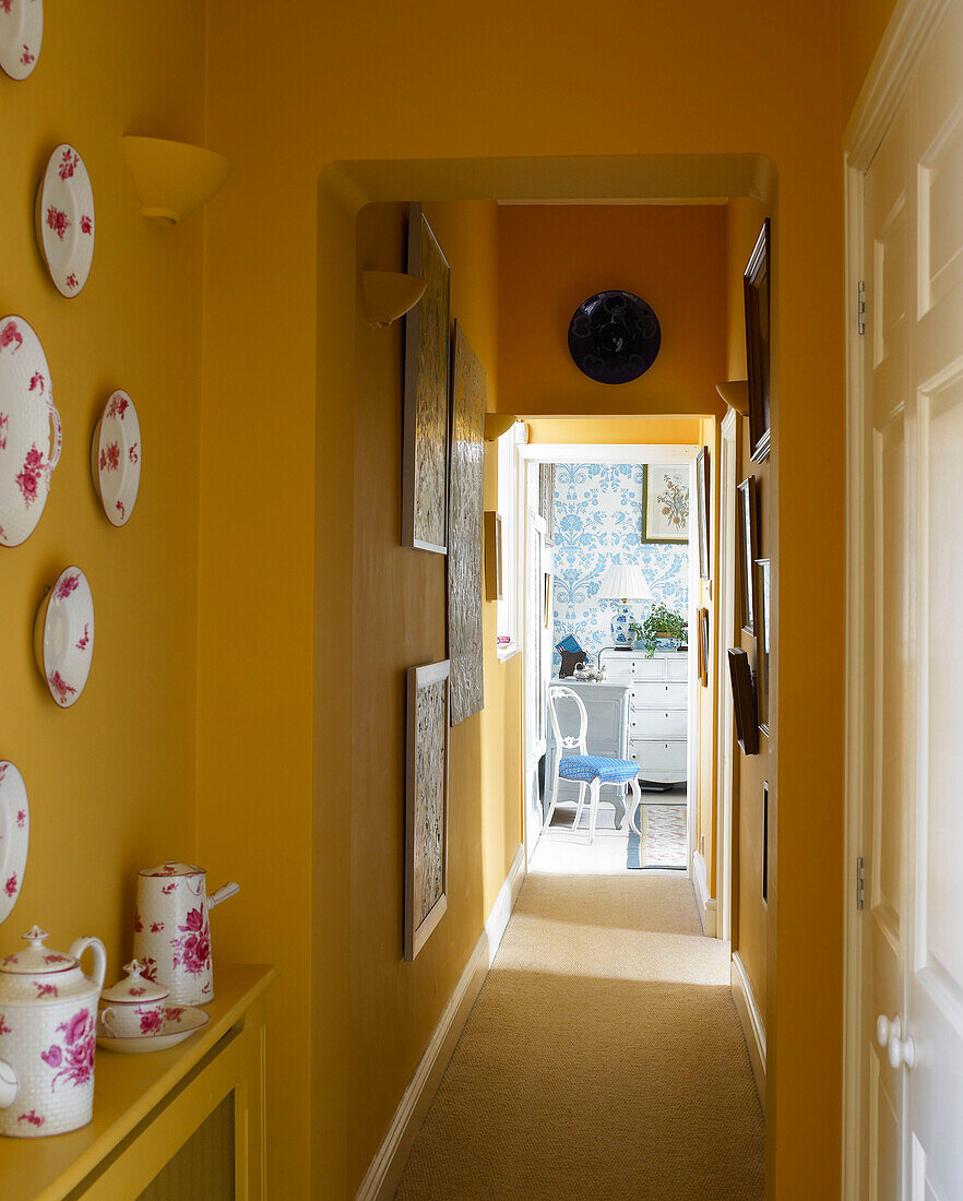 Yellow corridor decorated with crockery