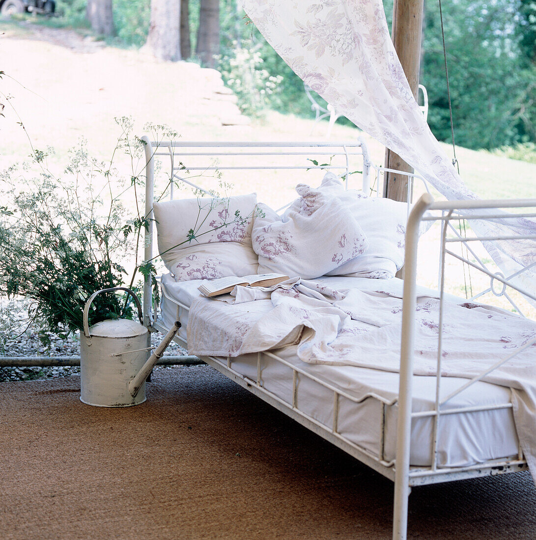Vintage style daybed in garden summer house
