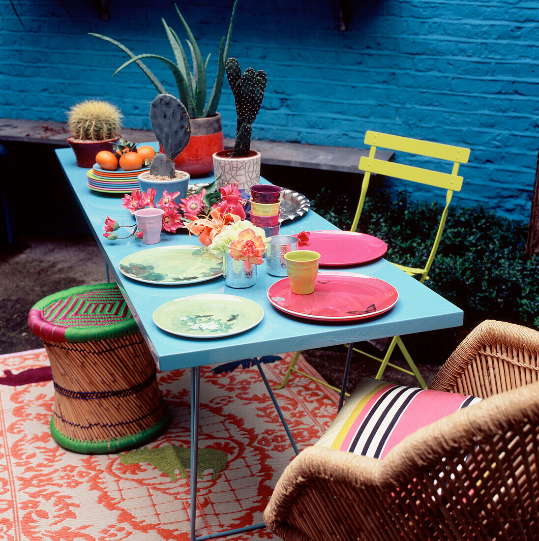 Colourful table setting in a small garden