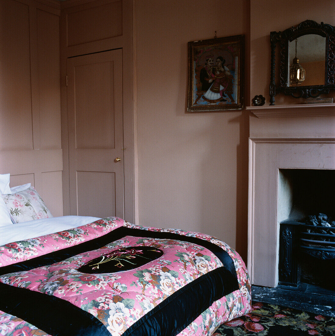 Vintage style bedroom with double bed and fireplace