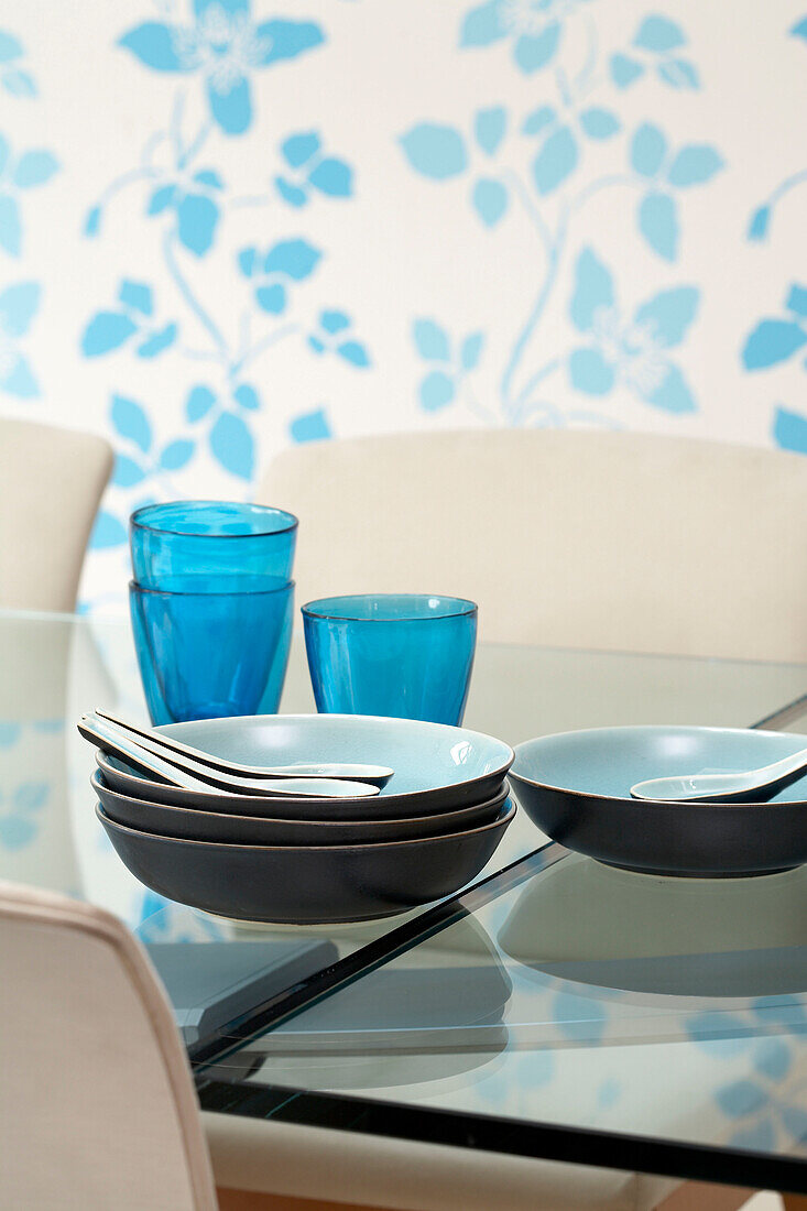 Blue glassware and bowls on dining table
