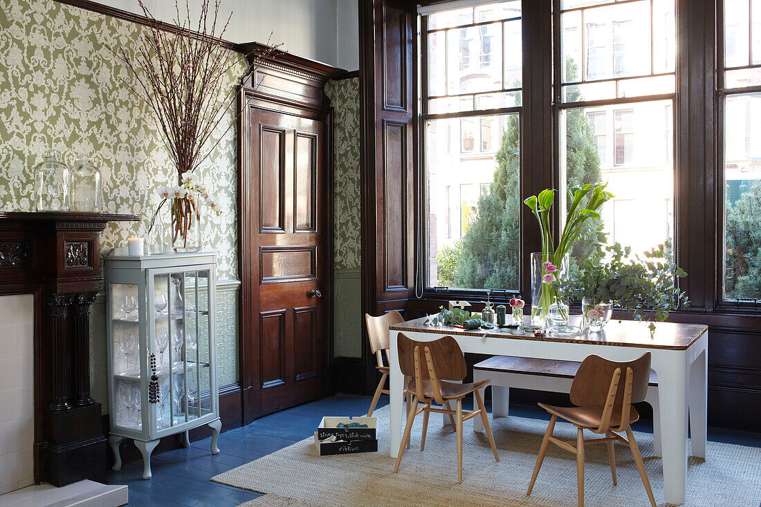 Dark wood dining area in Scottish apartment building UK