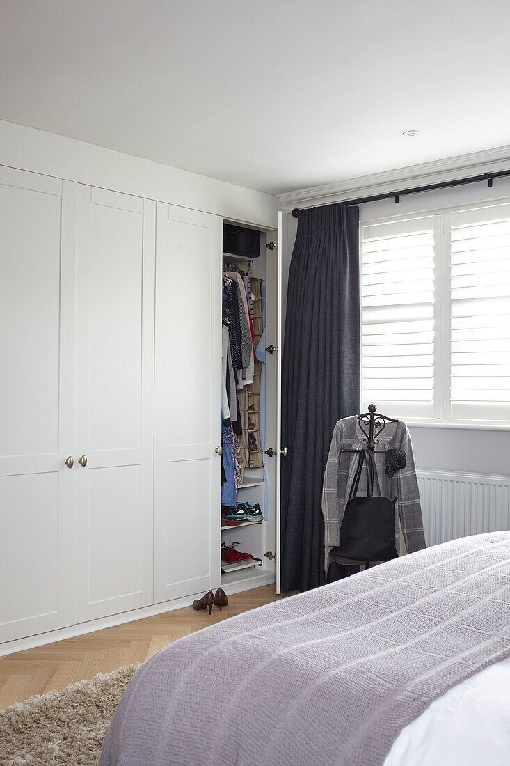 Fitted wall-to-wall wardrobes in bedroom of Buckinghamshire home UK