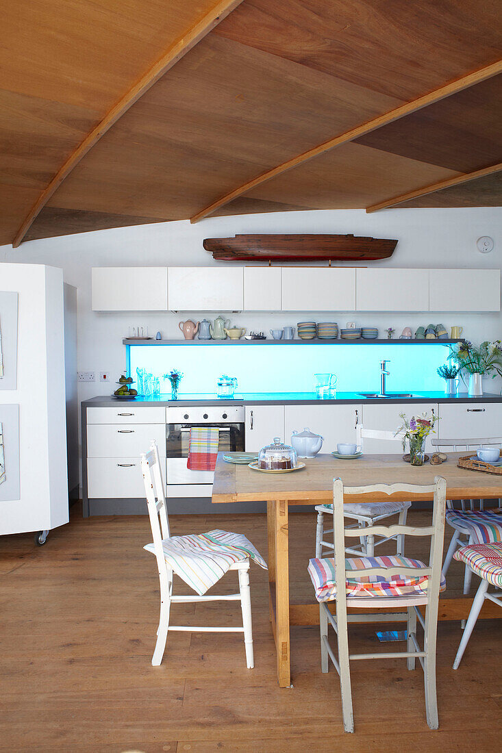 Open plan dining room kitchen in Bembridge houseboat Isle of Wight, UK