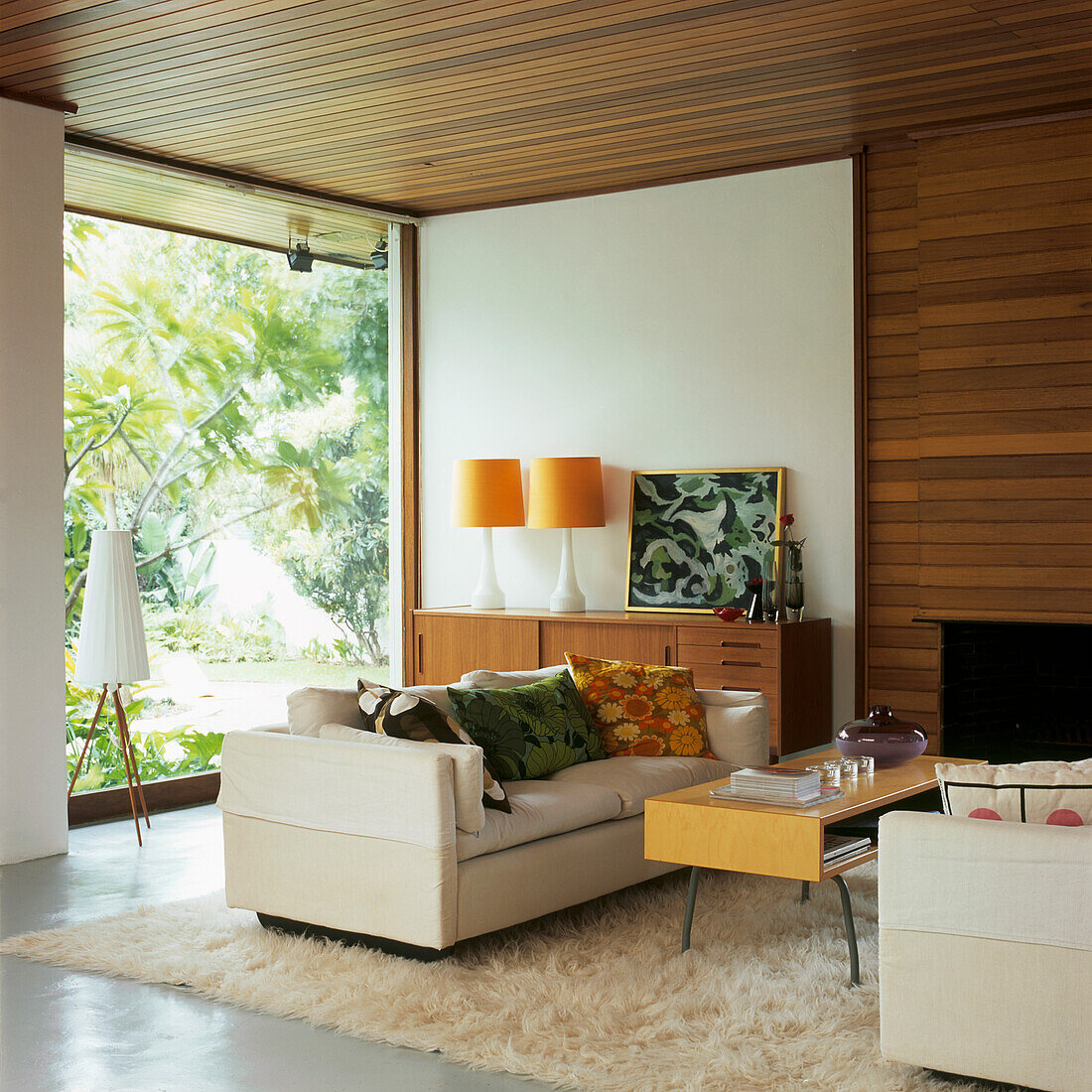 Comfortable retro living room with view of garden and shagpile rug