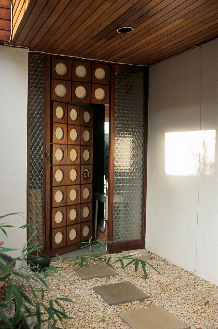 Gravel and slate leading to door