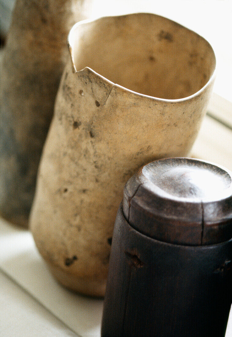 Close up of African clay and wooden pots