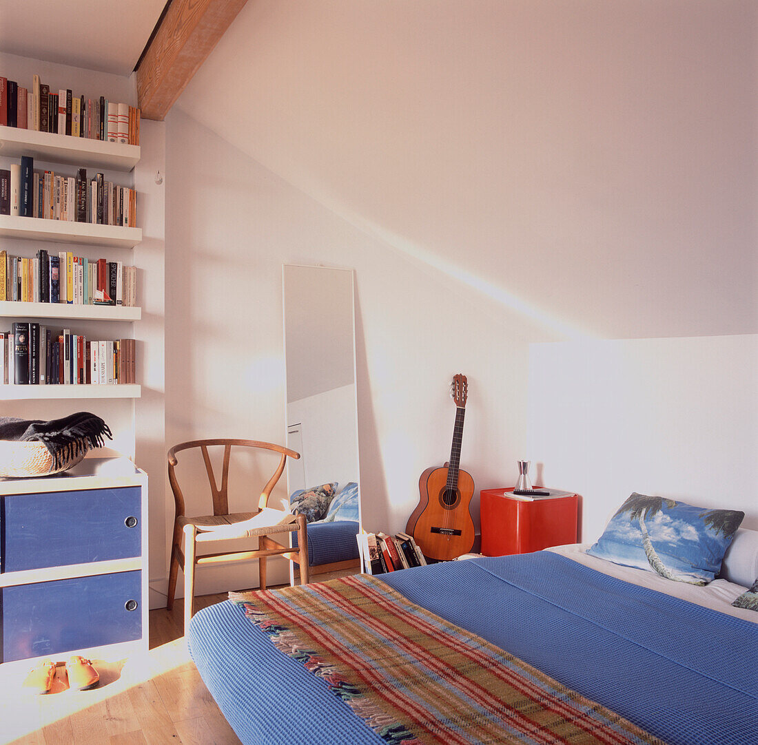 Top floor blue and white double bedroom under the eaves