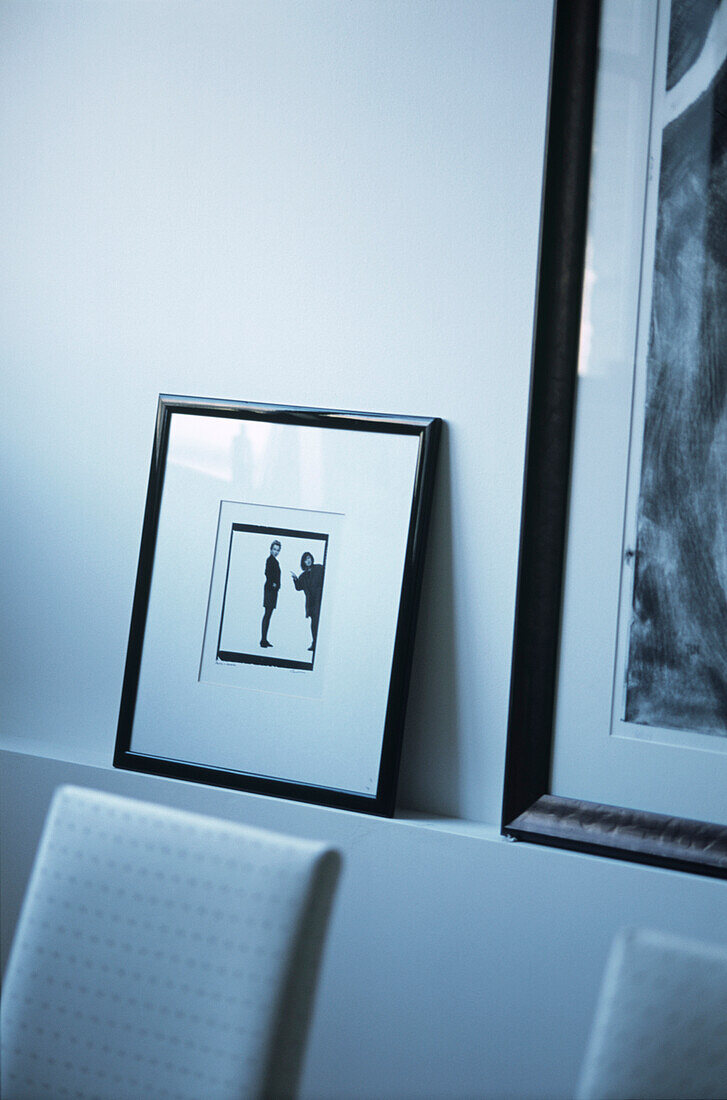 Close up of black and white frames behind seating