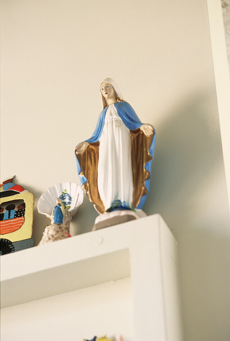 Mary Madonna figurine on shelf display