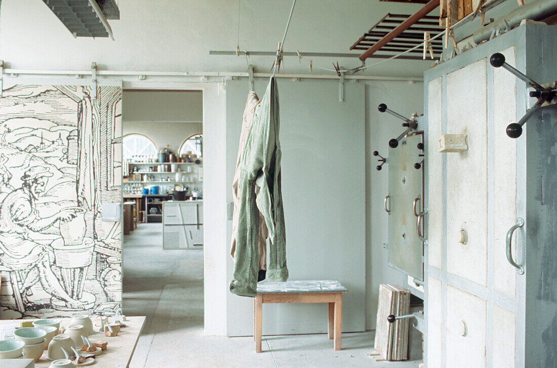 Large open plan white modern ceramicist studio workshop with partition sliding doors