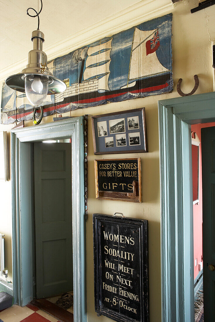 The Hallway is decorated with local memorabilia nautical charts and paintings