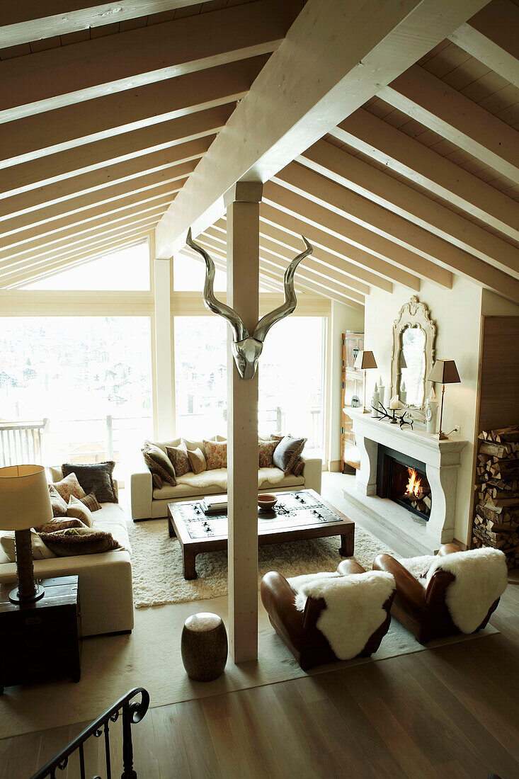 Elevated view of beamed living room in luxury Zermatt home, Switzerland