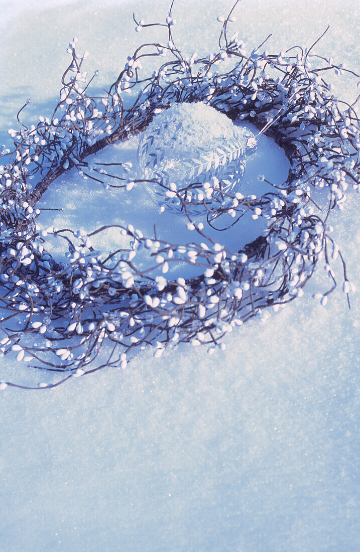 Christmas wreath resting in the snow