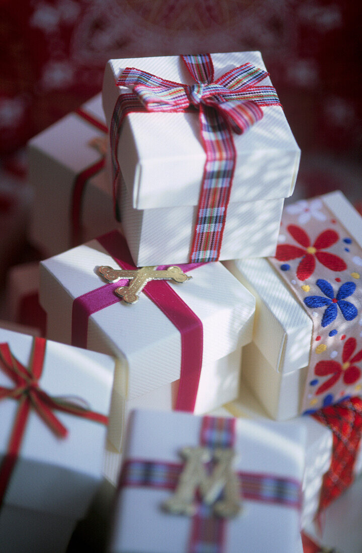 Christmas gift boxes tied with colourful ribbon