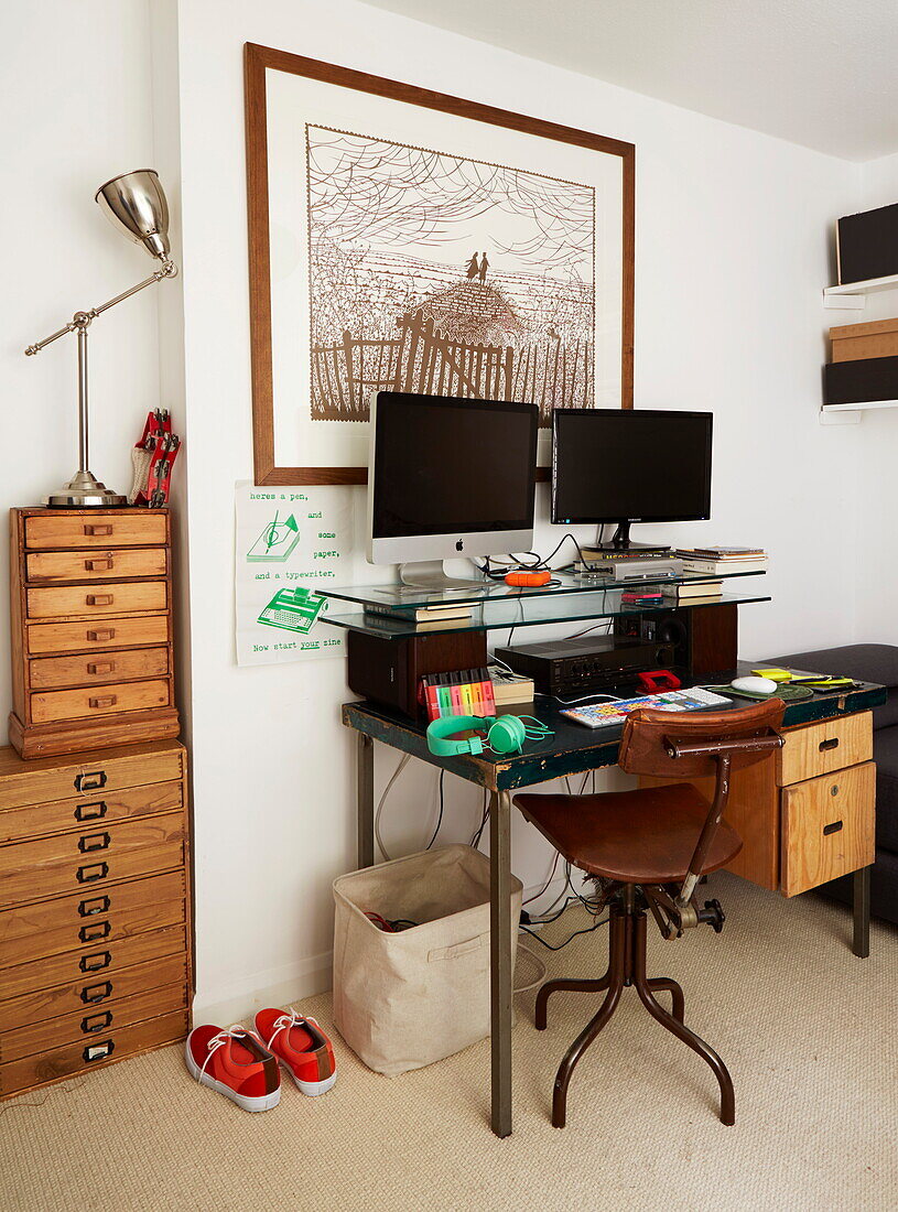 Deskspace with wooden filing units in London home, England, UK