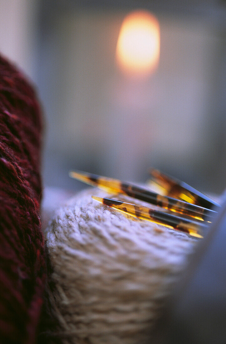 Close up of wool yarn with knitting needles