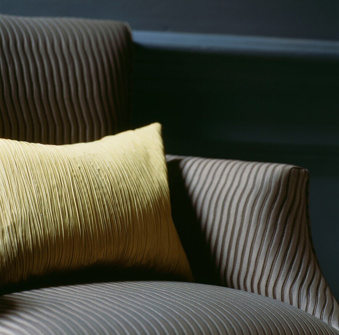 Yellow cushion on armchair