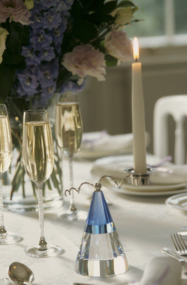 Blue and clear cut glass Swarovski crystal collectible on wedding guest table 