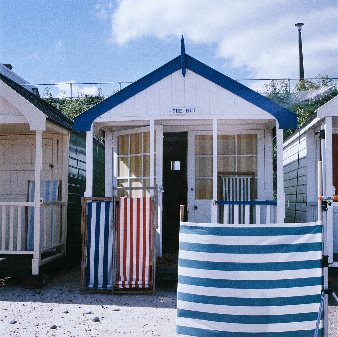 British beach hut with striped windbreaker