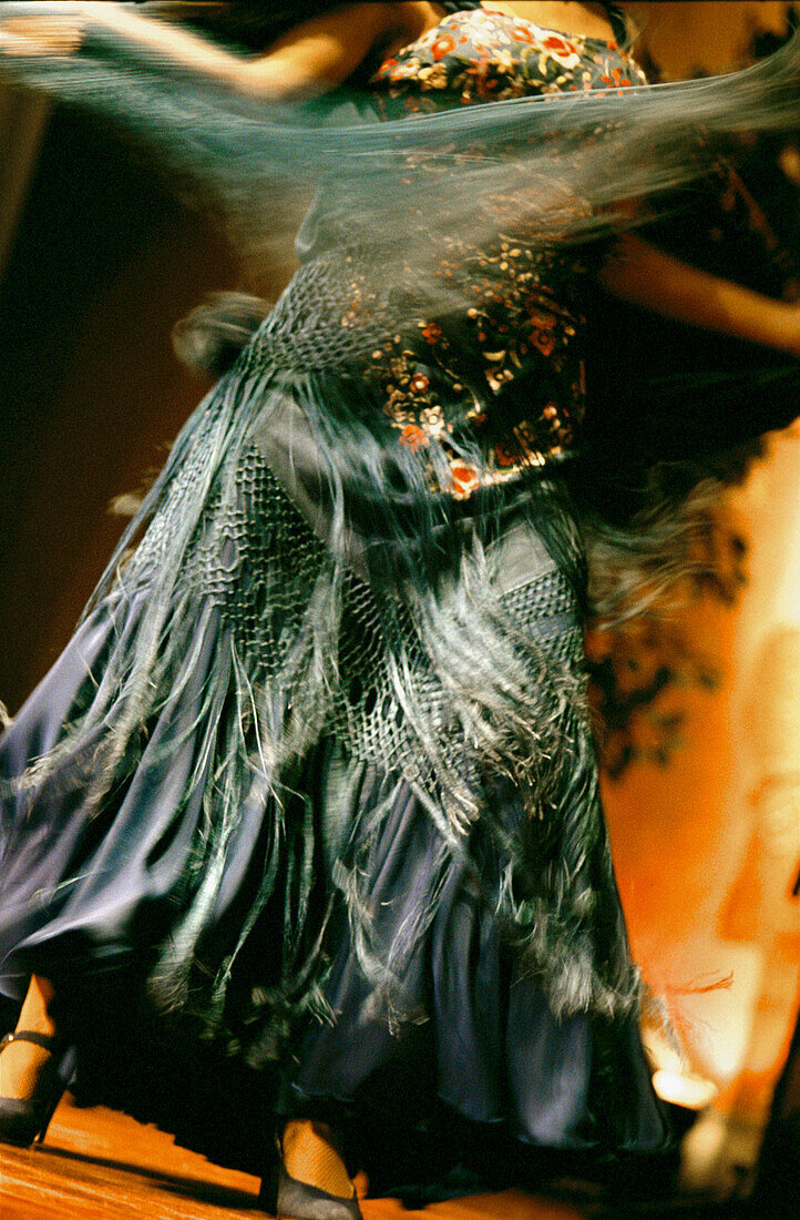 Flamenco dancer on stage in a tabloas in Seville