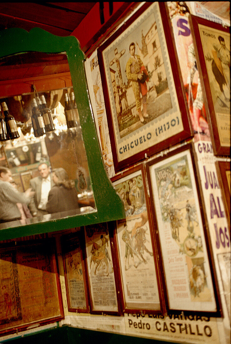 Customers mirrored in the Bullfighter's bar in Triana