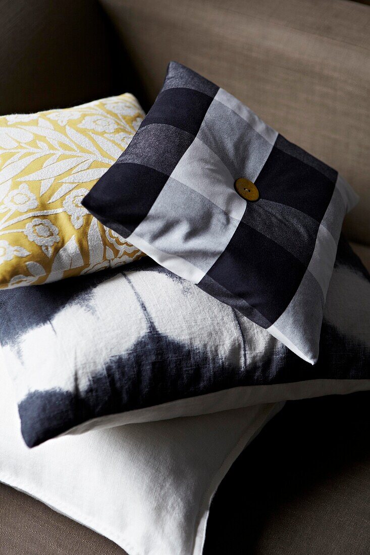 Blue  white and yellow cushions with button detail