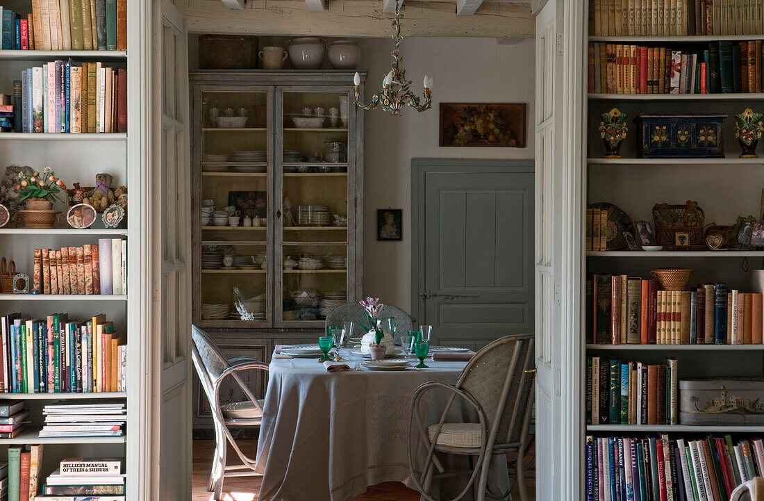 Home interior with bookshelf and dining table